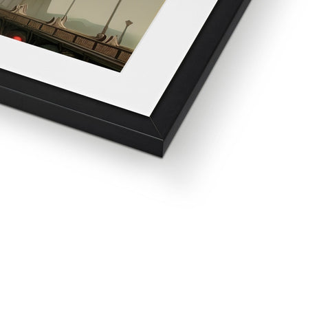 A picture frame holding a white photograph hanging on a wall.