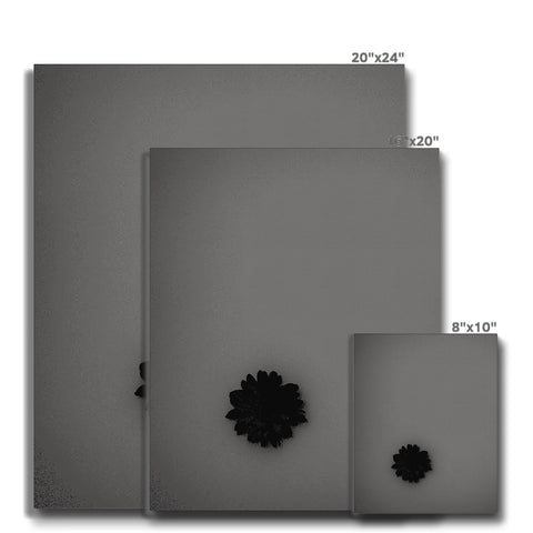 A black square plate on ceramic tile, with digital images of three different types of computers