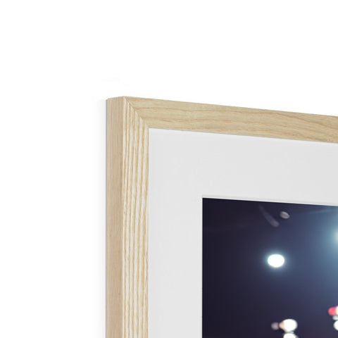 A photo frame sitting in a living room containing a wooden frame decorated with a close up