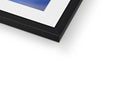 A blue photo is sitting on top of a black and yellow framed picture frame.