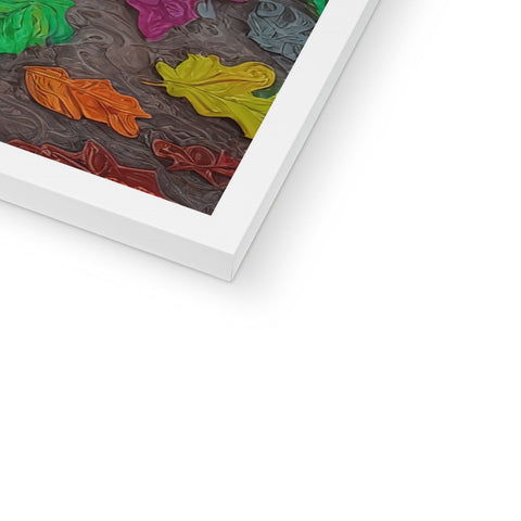 An art print on a bed with a colorful blanket on top of a pillow.