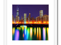 Art print shot of Chicago skyline next to skyscrapers with lights in the distance