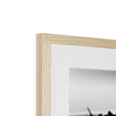 A photo of a wooden frame sitting in a frame on the wall in a living -