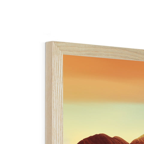 A wooden picture frame is sitting on a manteltop near a bookcase.