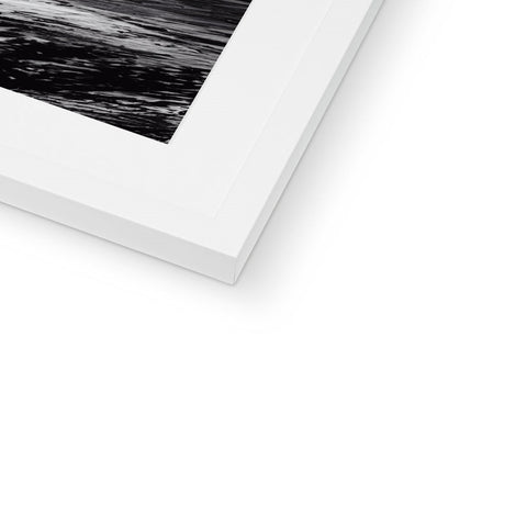 A close up of a picture of a black and white picture of ocean on a frame