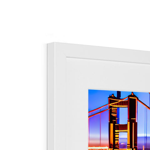 A couple of large colorful prints on a white picture frame behind a frame.