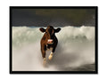 A cow that looks at the camera under a tall television screen.