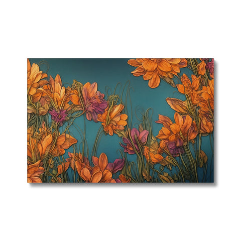 An art print on a wooden background sitting on a blanket next to several flowers.