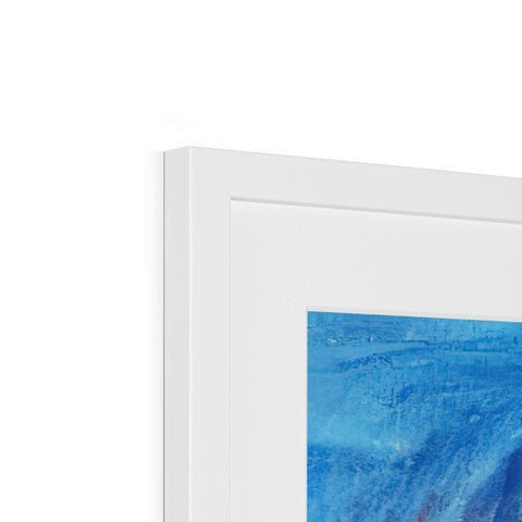A blue picture frame hanging from a frame on a frame with a piece of art behind