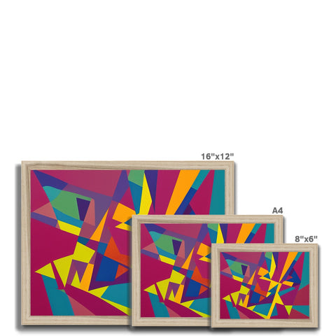 Four colorful cut up blocks sitting in a picture frame next to white plates