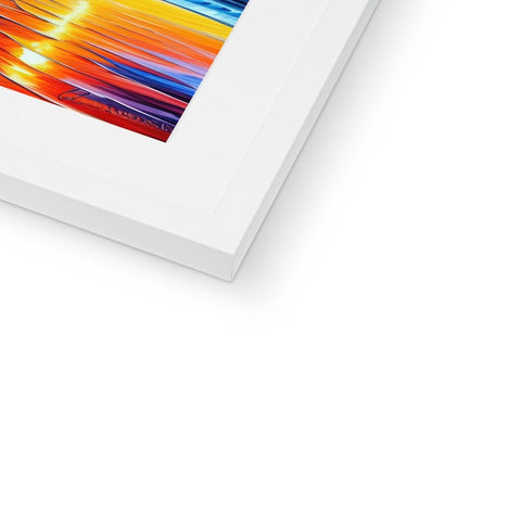 A print of an image of a rainbow in a frame on a shelf.