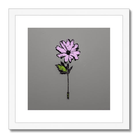 A small white floral art print with a purple blossom on it.