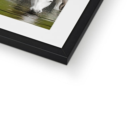 An art print on a framed photo of an elephant displayed in a white frame.