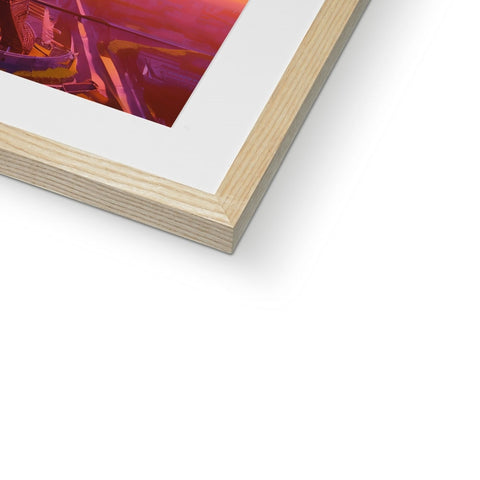 A small piece of wood on top of a photograph that is in a picture frame.