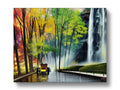 Art print on wood panel in front of flowing water and a waterfall.