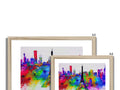 A picture of three cityscapes and an art print of a city skyline set on