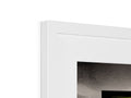 a white photo frames with the color of a wall and picture frame on top of it
