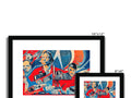 A row of photo frames sitting on a white wall with a red and blue photograph on