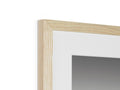 A white picture frame with three different pictures sitting underneath a close up of a mirror.
