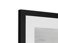 A black and white photo with black background is in a picture frame for a TV.