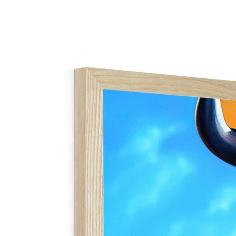 A very large picture of a wood framed object on a shelf.
