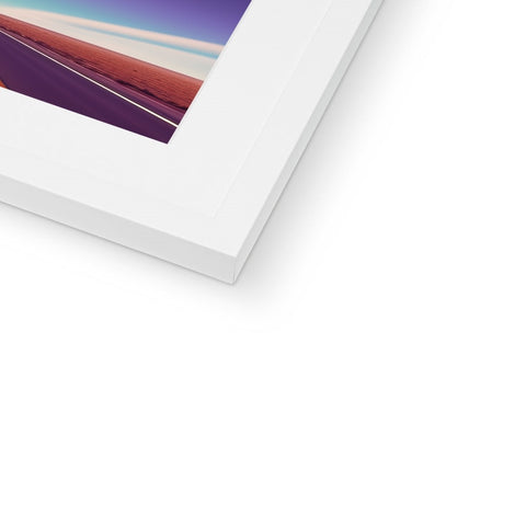 A white image of an iPhone and a photograph of a picture frame on a white table