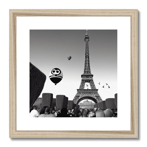 An art print with an image of a large balloon flying over Paris.