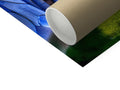 A blue roll of tissue on a paper wrapper on a sheet covered tray.