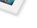 A white picture of an image on a photo frame with an electronic item on