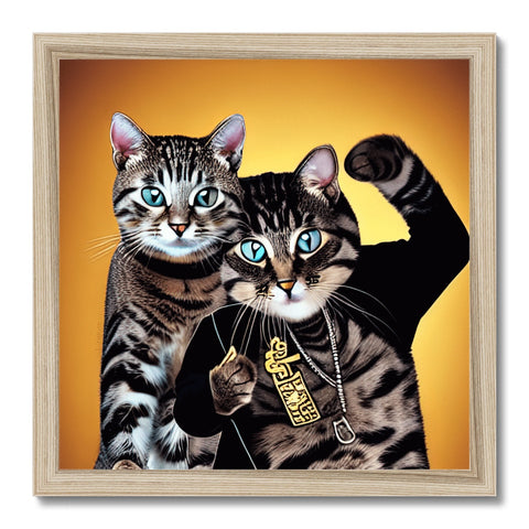 Two cats are shown with gold backgrounds on two pictures inside of a gold framed frame.