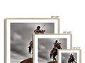 A set of photo frames with images of soldiers standing on a fireplace.