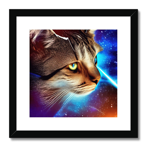A cat sitting atop a framed photo of cats with a laser light.