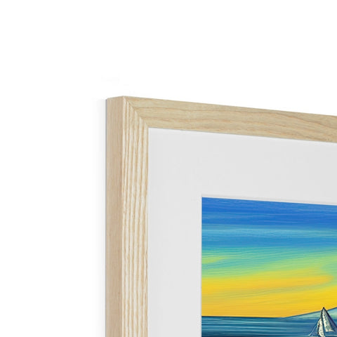 The picture of a sailboat passes over a sunset that is framed in wood.