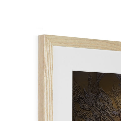 A photo of a wood frame with silver artwork in one side and a wooden frame in