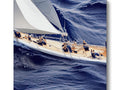 A sail raft sitting on the side of a stormy sea with sailboats lining the