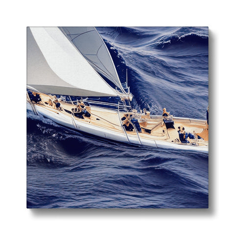 A sail raft sitting on the side of a stormy sea with sailboats lining the