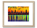 A large colorful glass city skyline with a colorful image hanging on a wooden frame.