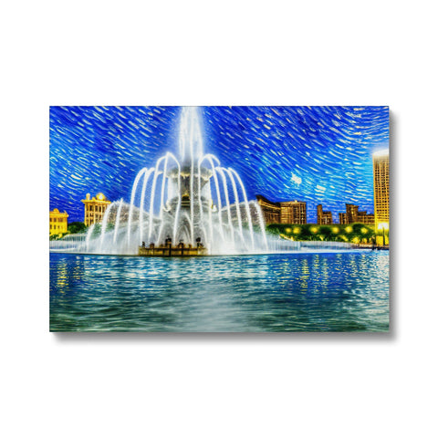 A cityscape with a fountain, city lights and water near a fountain.