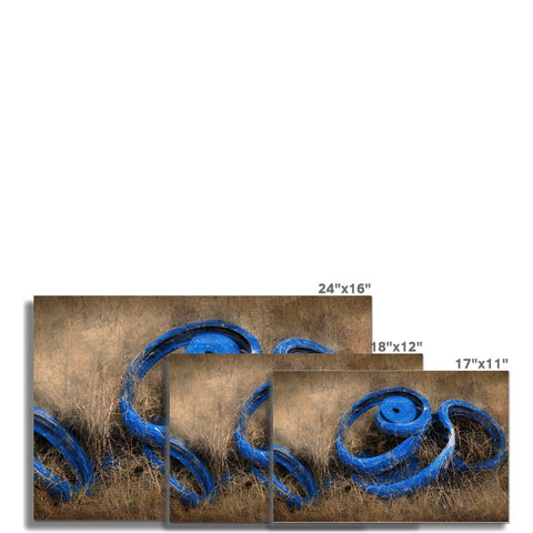 A picture of wood, blue and brown rug on a wall sitting in front of a