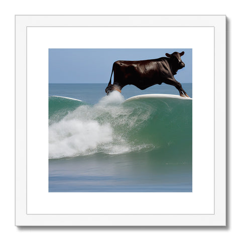 A black and white framed shot of a bull riding on a beach.