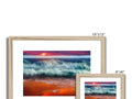 A picture frame topped with four colorful beach photographs set on top of an easel with