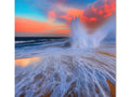 A photo print of a beautiful sunset with blue and pink ocean waves.
