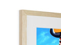 A framed picture of a ram is sitting on top of a wooden frame.
