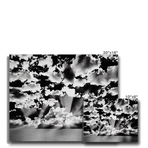 Black and white framed artwork with a white background with the shape of clouds.