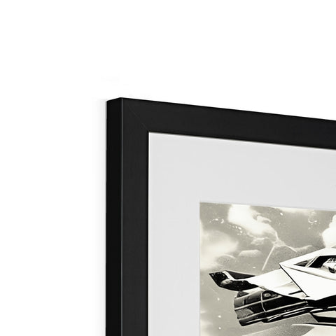A black and white framed airplane winged fighter plane is sitting in a picture frame.