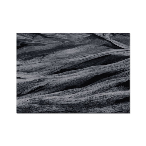 Black and white photos of green area rug covered with black wool cloths.