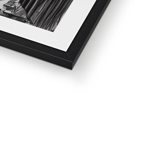A framed photograph of a photo is on a black and white photo frame.