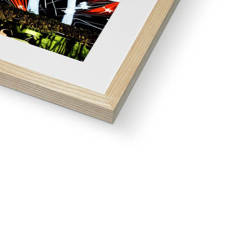A picture of an art print sitting on a wood frame on a table.