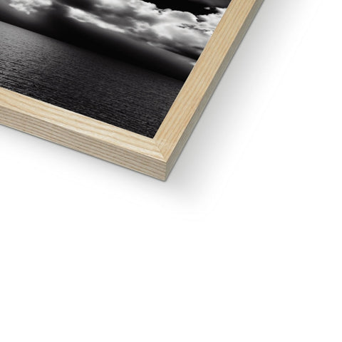 A picture frame with a picture is in a dark wooden background.