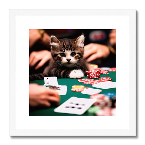 A cat laying by a glass of wine while playing poker with a game of cards at